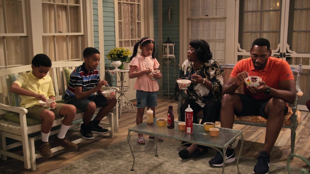 Adidas Orange Shirt and Nike Sneakers Worn by Anthony Alabi in Family Reunion – Season 1 Episode 5, “Remember Grace Under Fire” (2019) (Image 1)