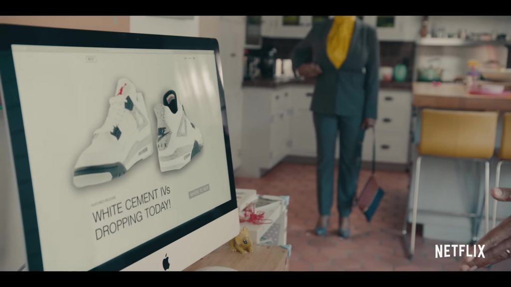 Air Jordan 4 Retro ‘White Cement Grey' Sneakers and Apple iMac in Sneakerheads Season 1 (2020) (Image 1)