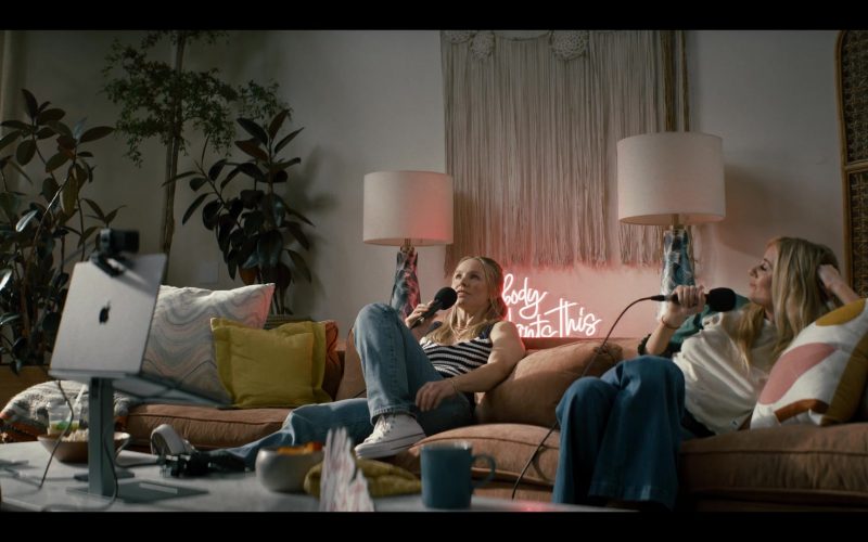 Apple MacBook and Converse Shoes in Nobody Wants This S01E01 (2024) (Image 1)
