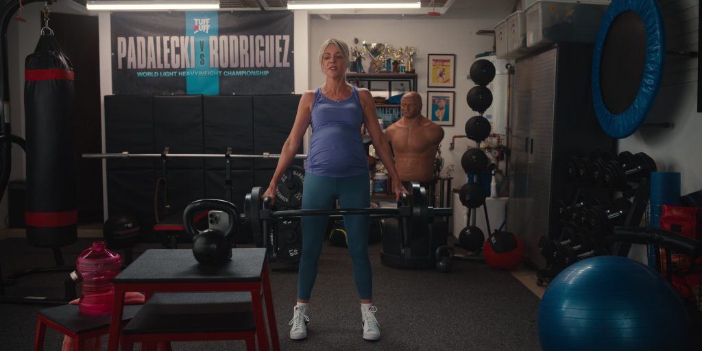 Apple iPhone, Nike Shoes in Hacks S04E06 “Mrs. Table” (2025) (Image 2)