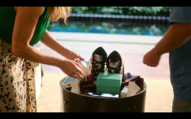 Apple iPhones, Nike Air Jordan Shoes and Tiffany & Co. in Murder Mystery 2 (2023) (Image 1)