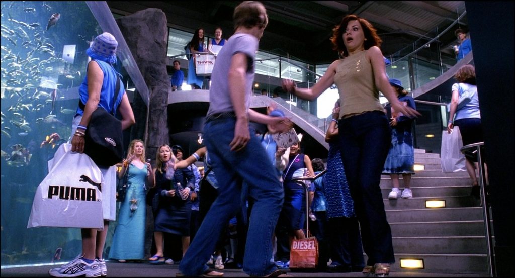 Asics Sneakers, Puma and Diesel Store Bags in Josie and the Pussycats (2001) (Image 1)
