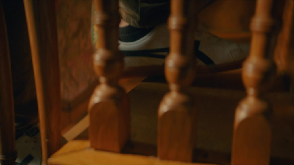 Asics Sneakers in Girl Haunts Boy (2024) (Image 1)