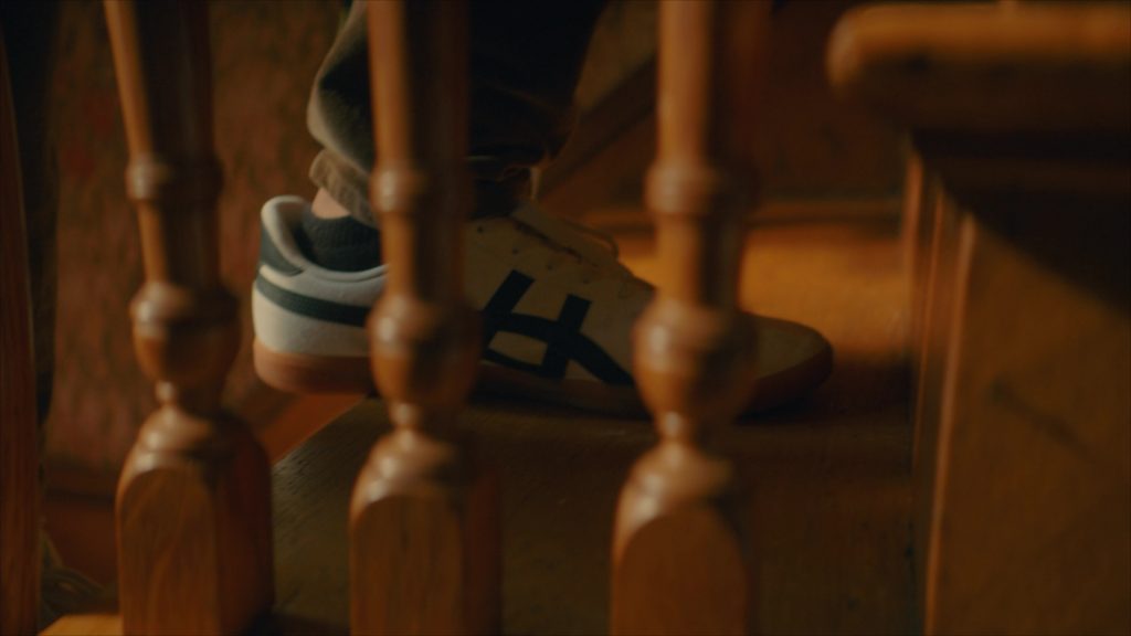 Asics Sneakers in Girl Haunts Boy (2024) (Image 2)