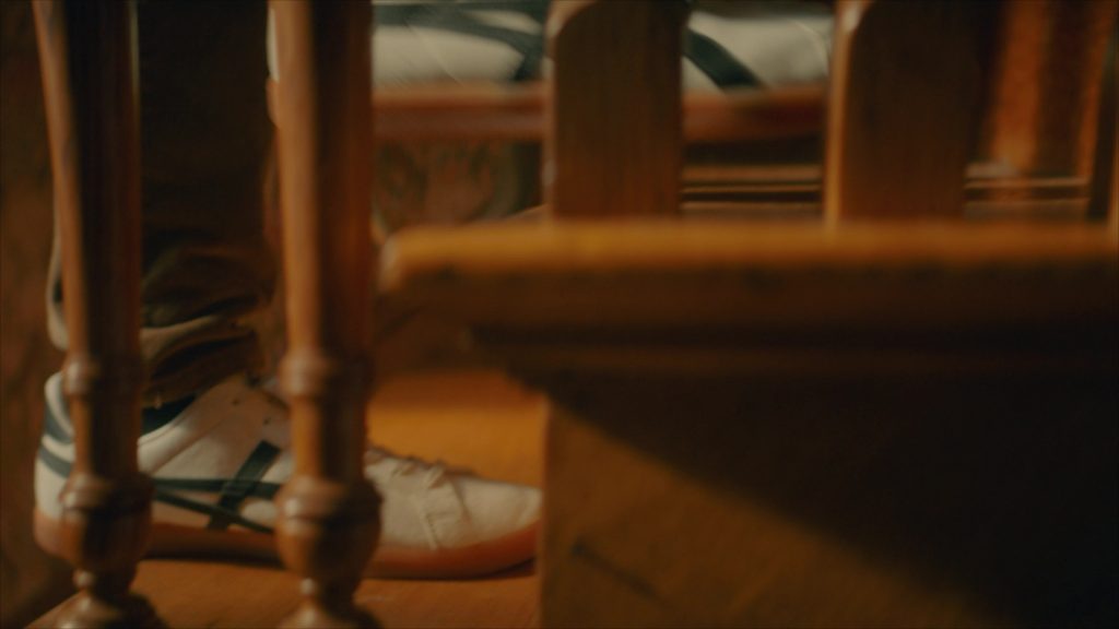 Asics Sneakers in Girl Haunts Boy (2024) (Image 3)