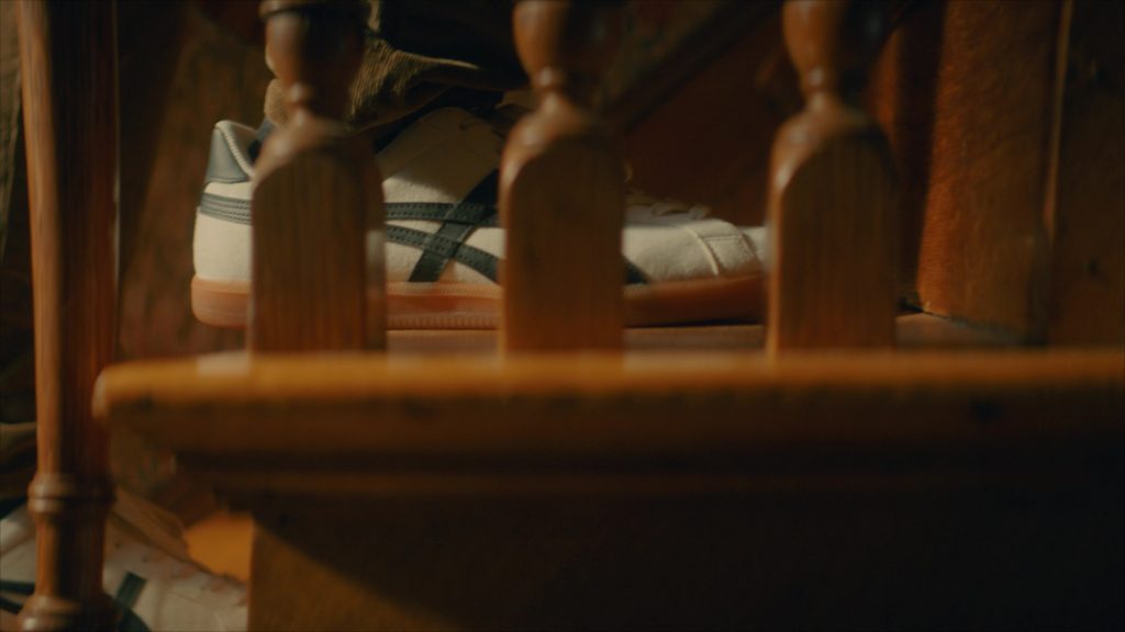 Asics Sneakers in Girl Haunts Boy (2024) (Image 4)