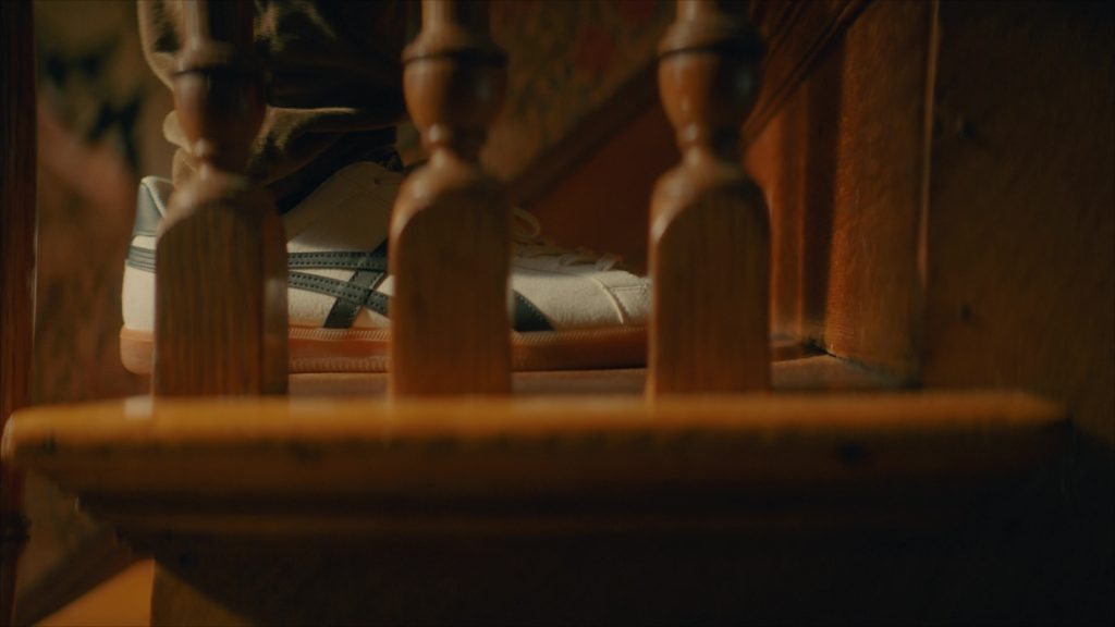 Asics Sneakers in Girl Haunts Boy (2024) (Image 5)