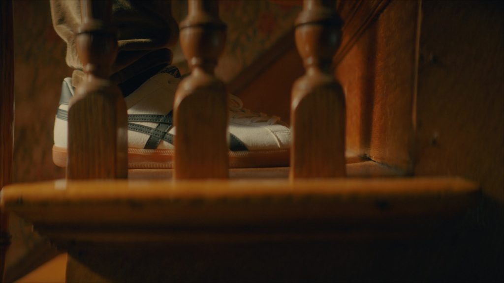 Asics Sneakers in Girl Haunts Boy (2024) (Image 6)
