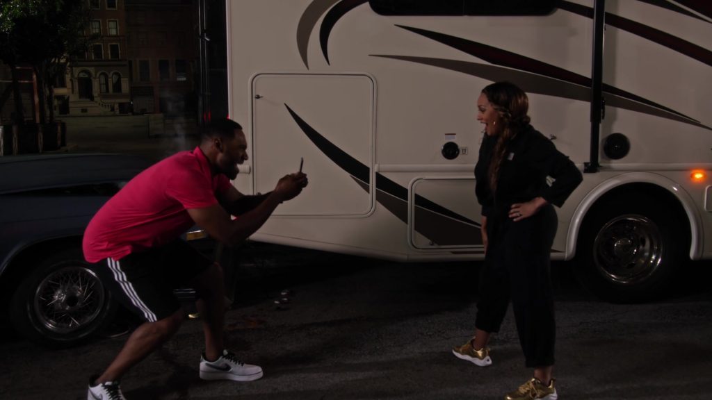 Champion Gold Sneakers Worn by Tia Mowry and Nike Shoes Worn by Anthony Alabi in Family Reunion – Season 1 Episode 6, “Remember That Crazy Road Trip” (2019) (Image 2)