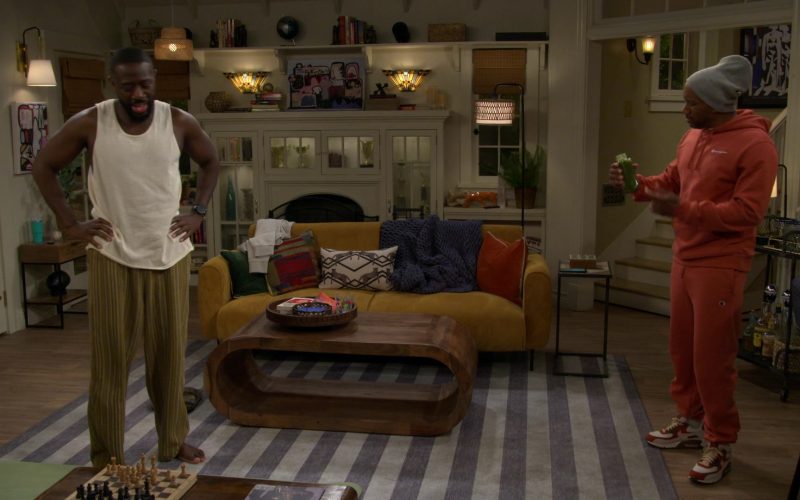 Champion Hoodie, Grey Goose, Tanqueray, Nike Shoes in The Neighborhood S08E11 “Welcome to the Baby Proofing” (2026) (Image 1)