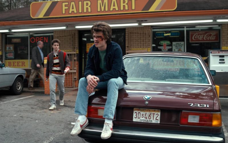 Coca-Cola Signs and Nike Shoes Worn by Joe Keery (Steve Harrington) in Stranger Things - The Bathtub (2016) (Image 1)