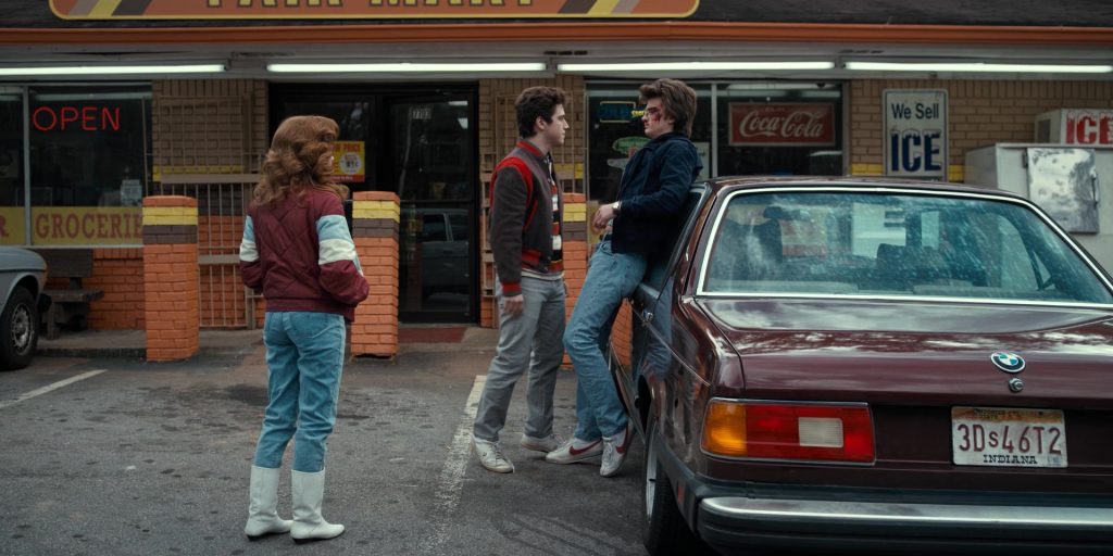 Coca-Cola Signs and Nike Shoes Worn by Joe Keery (Steve Harrington) in Stranger Things - The Bathtub (2016) (Image 2)