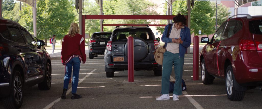 Converse Shoes and Herschel Bag in Sweethearts (2024) (Image 3)