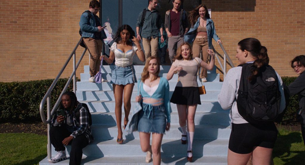 Converse Sneakers and The North Face Backpack in Mean Girls (2024) (Image 1)