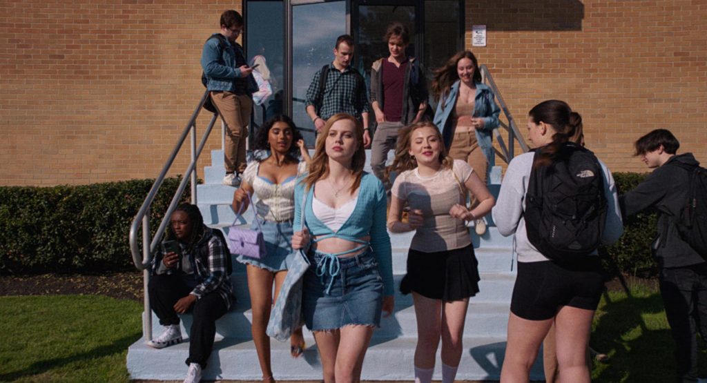 Converse Sneakers and The North Face Backpack in Mean Girls (2024) (Image 2)