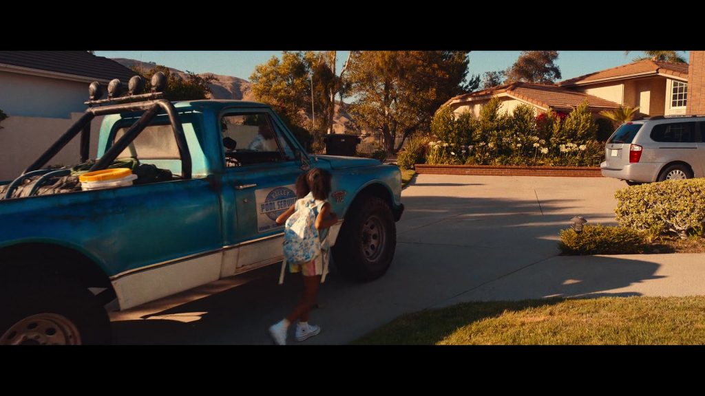 Converse White Shoes of Zion Broadnax as Paige in Day Shift (2022) (Image 1)