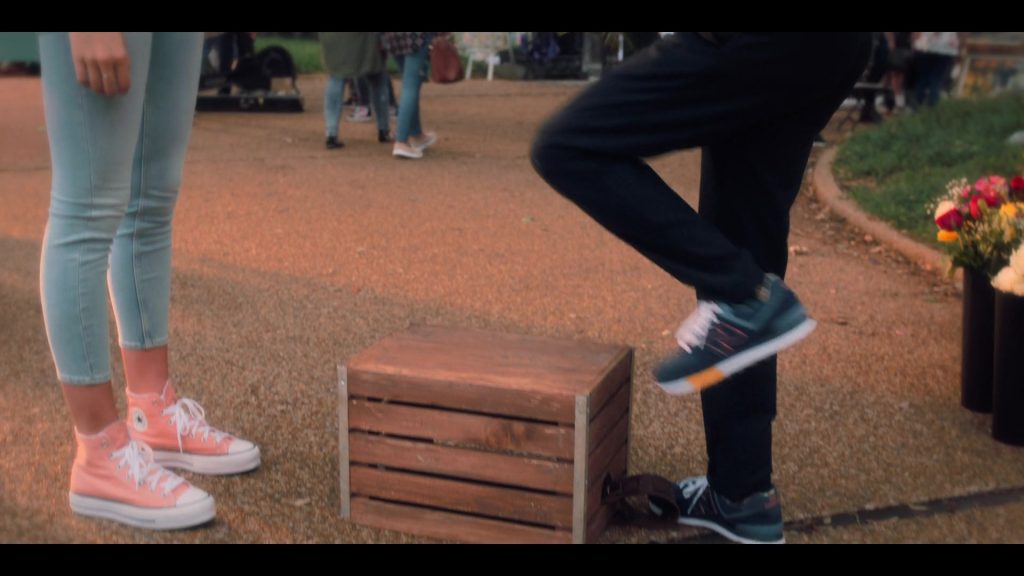 Converse and New Balance Shoes in Tall Girl 2 (2022) (Image 1)