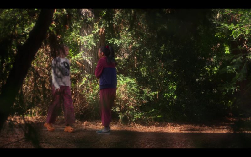 Crocs Orange Platform Heeled Mules of Zoe Colletti as Gia and Reebok Shoes of Lana Condor as Erika in Boo, Bitch S01E01 “Life's a Bitch and Then You Die” (2022) (Image 1)