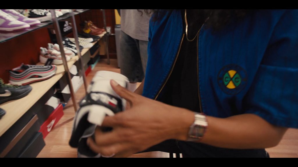 Cross Colours Women's Shirt and Nike Sneakers in Colin in Black & White S01E01 “Cornrows” (2021) (Image 1)