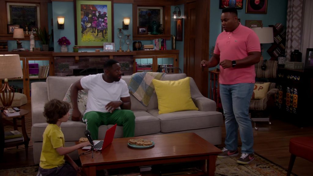 Lacoste Polo Shirt and Nike Shoes Worn by Marcel Spears as Marty in The Neighborhood Season 2 Episode 5 “Welcome to Soul Food” (2019) (Image 1)