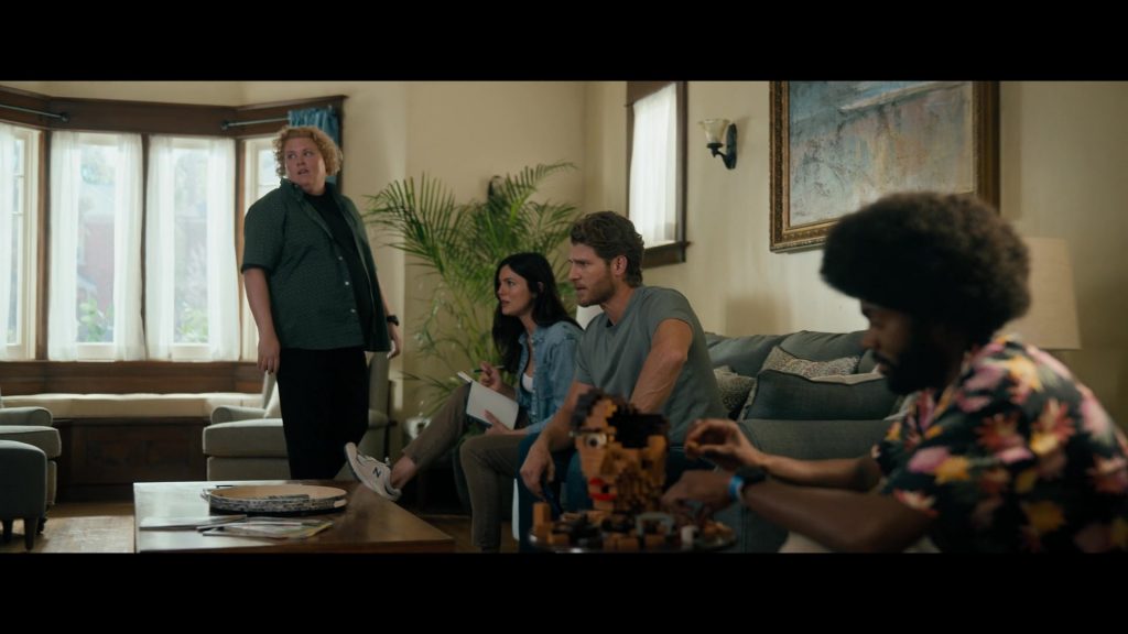 Lego, New Balance Shoes in Fubar S02E01 “Fullest House” (2025) (Image 2)