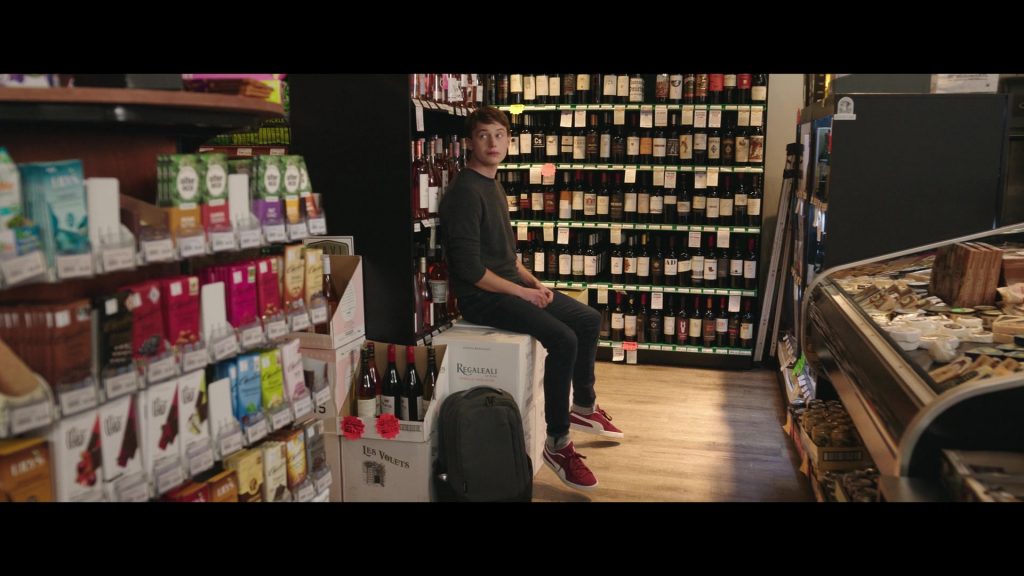 Les Volets Pinot Noir, Tasca d'Almerita Regaleali Bianco Sicilia Wine Boxes and Puma Sneakers Worn by Uly Schlesinger as Tyler in Jerry and Marge Go Large (2022) (Image 1)