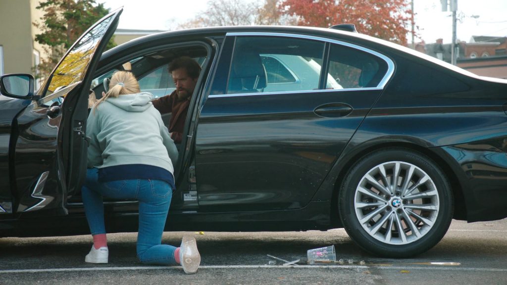 Levi's Jeans, Reebok Shoes, Dunkin' Coffee Drink in Tires S02E09 “The Radio Ad” (2025) (Image 12)