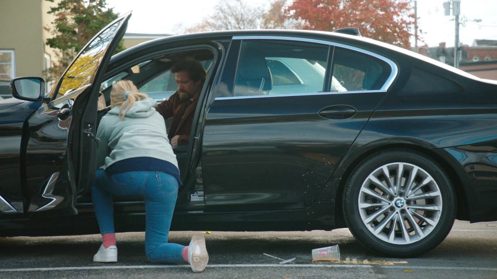 Levi's Jeans, Reebok Shoes, Dunkin' Coffee Drink in Tires S02E09 “The Radio Ad” (2025) (Image 13)