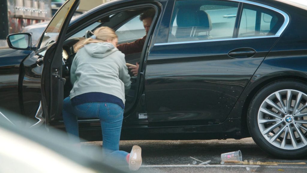 Levi's Jeans, Reebok Shoes, Dunkin' Coffee Drink in Tires S02E09 “The Radio Ad” (2025) (Image 16)