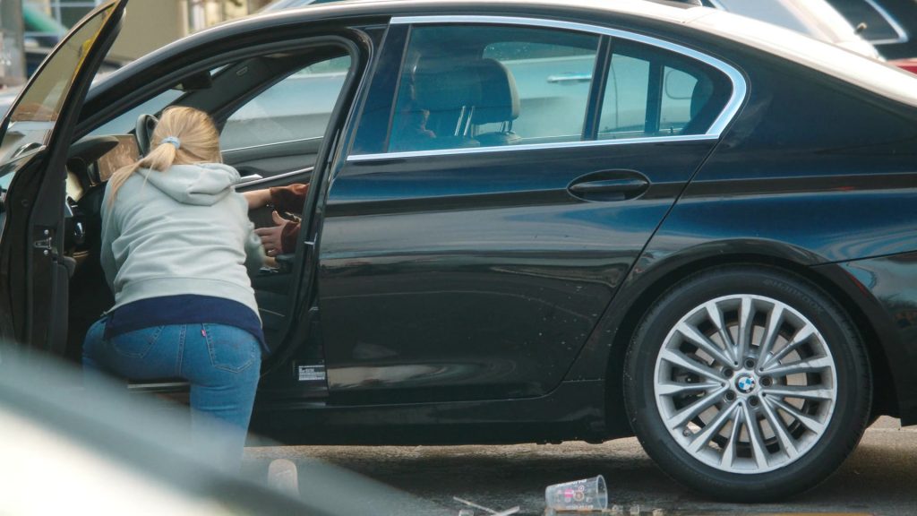 Levi's Jeans, Reebok Shoes, Dunkin' Coffee Drink in Tires S02E09 “The Radio Ad” (2025) (Image 3)