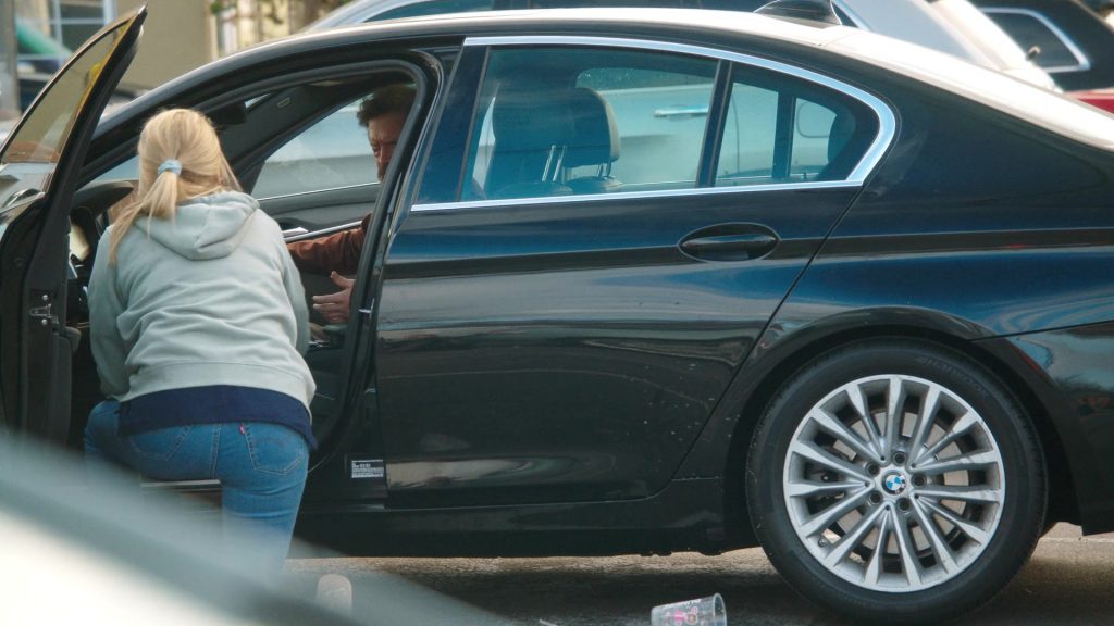 Levi's Jeans, Reebok Shoes, Dunkin' Coffee Drink in Tires S02E09 “The Radio Ad” (2025) (Image 6)