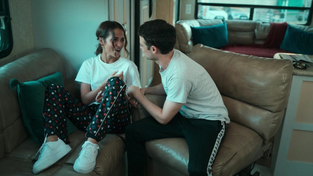 Louis Vuitton Trousers and Puma White Sneakers Worn by Alicia Vikander as Mira in Irma Vep S01E03 “Dead Man's Escape” (2022) (Image 1)