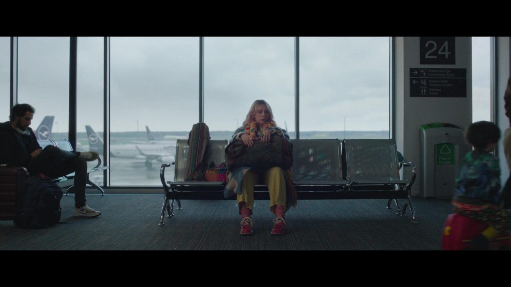 Lufthansa, Nike Shoes in Goodbye June (2025) (Image 2)