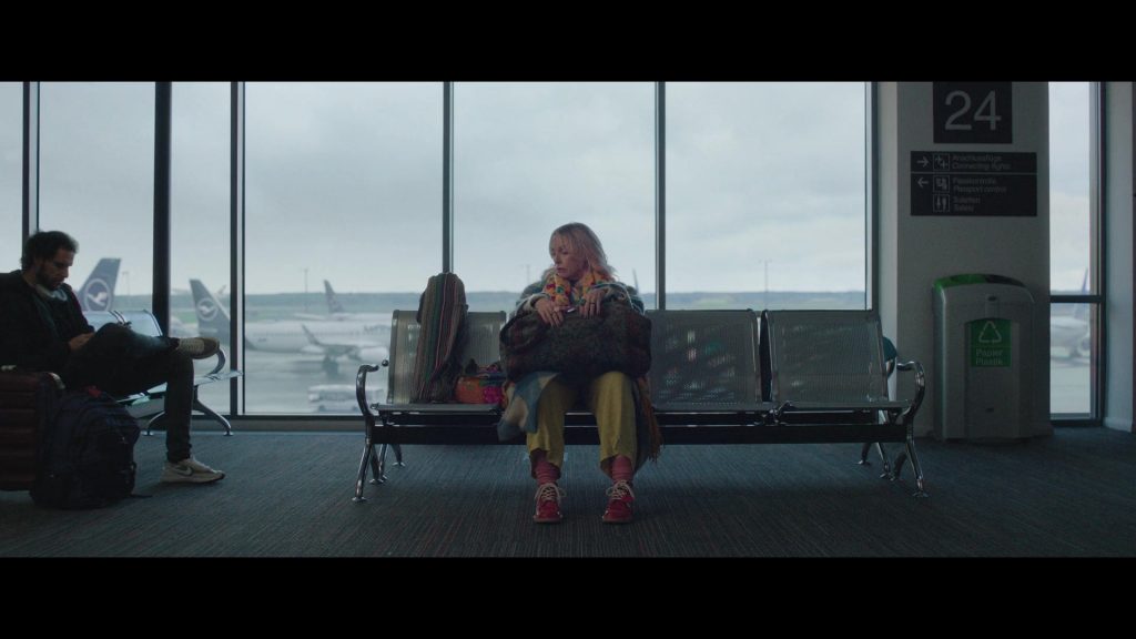 Lufthansa, Nike Shoes in Goodbye June (2025) (Image 6)