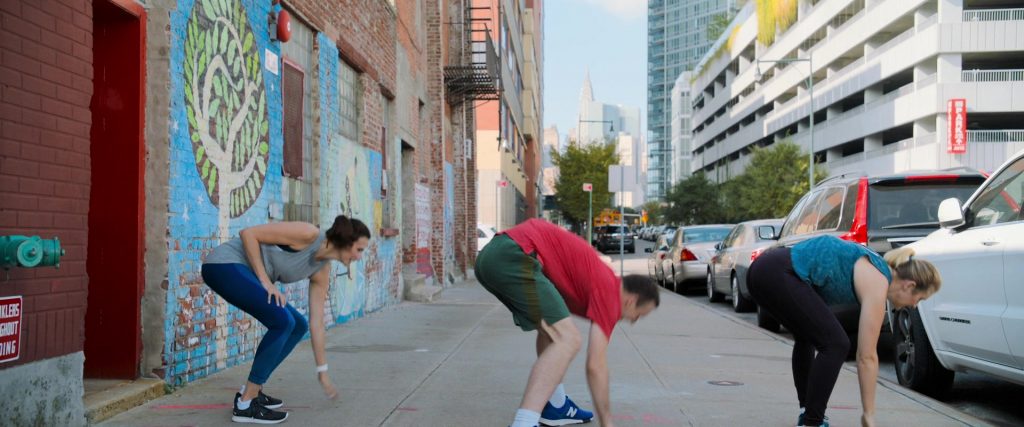 New Balance Blue Sneakers Worn by Micah Stock in Brittany Runs a Marathon (2019) (Image 1)