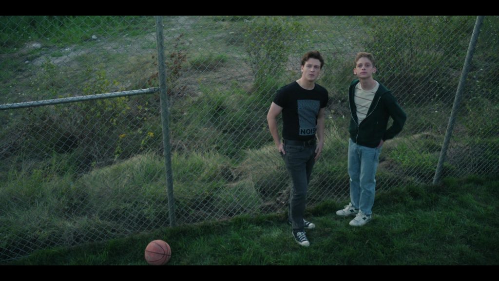 New Balance, Converse Shoes in The Institute S01E02 “Shot for Dots” (2025) (Image 1)