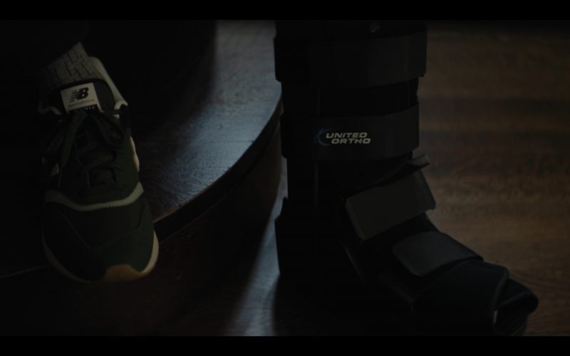 New Balance Shoes and United Ortho in Emperor of Ocean Park S01E10 (2024) (Image 1)