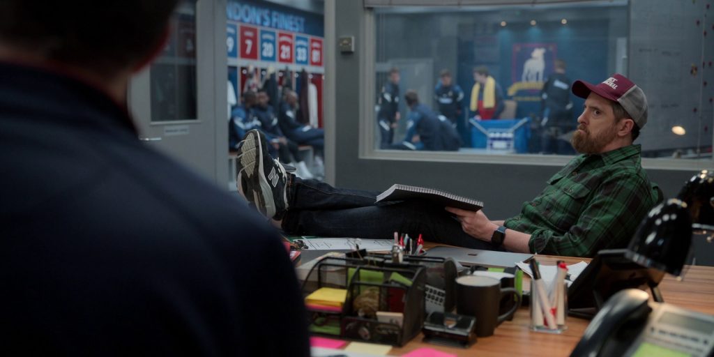 New Balance Sneakers, Apple MacBook and Smartwatch of Brendan Hunt as Coach Willis Beard in Ted Lasso S03E12 “So Long, Farewell” (2023) (Image 1)
