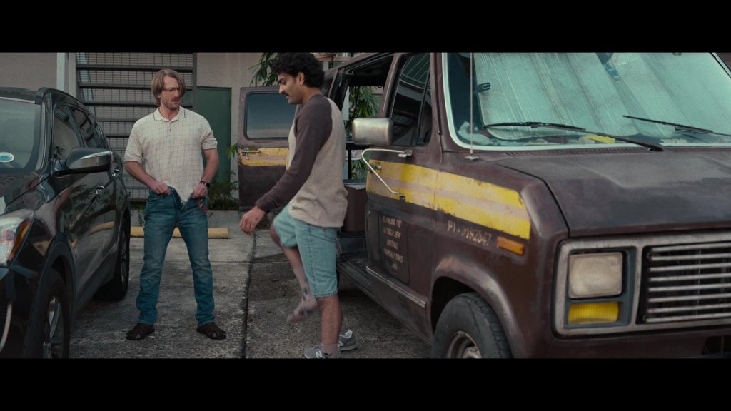 New Balance Sneakers in Hit Man (2023) (Image 4)