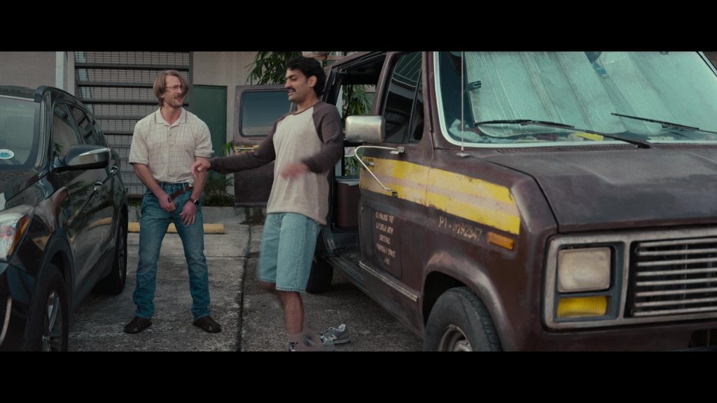 New Balance Sneakers in Hit Man (2023) (Image 5)