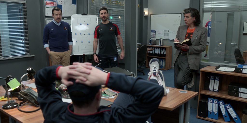 New Balance Sneakers of Brendan Hunt as Coach Beard and Nike Tops Worn by Jason Sudeikis & Brett Goldstein in Ted Lasso S03E03 “4-5-1” (2023) (Image 1)