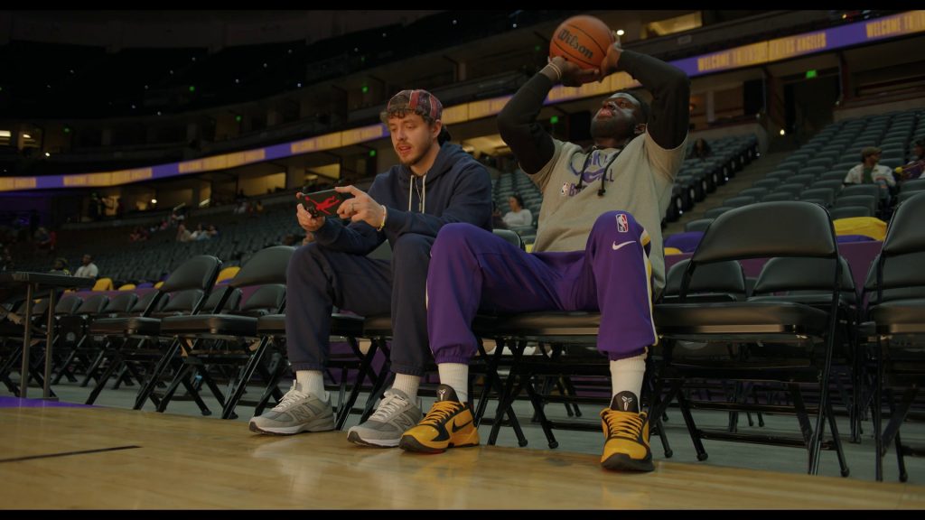 New Balance an Nike Shoes, Nike Pants, Wilson Basketball in White Men Can't Jump (2023) (Image 1)