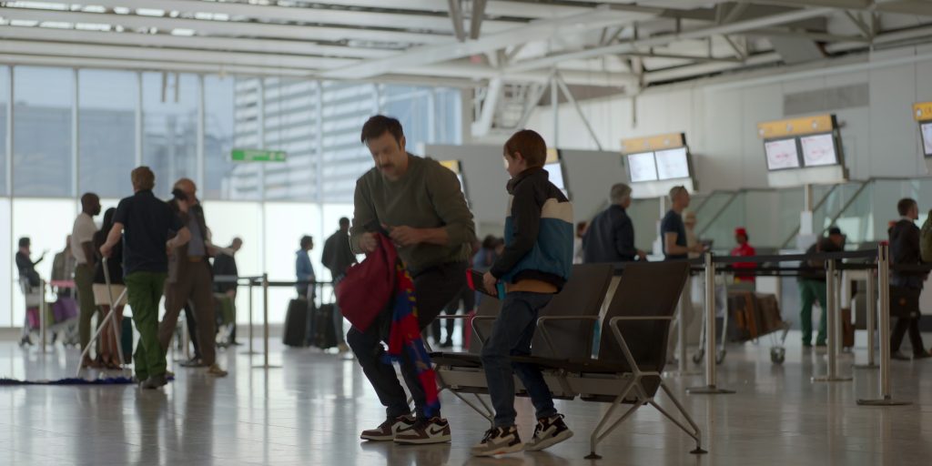 Nike Air Jordan 1 Low ‘Mocha' Sneakers Worn by Jason Sudeikis in Ted Lasso S03E01 “Smells Like Mean Spirit” (2023) (Image 1)