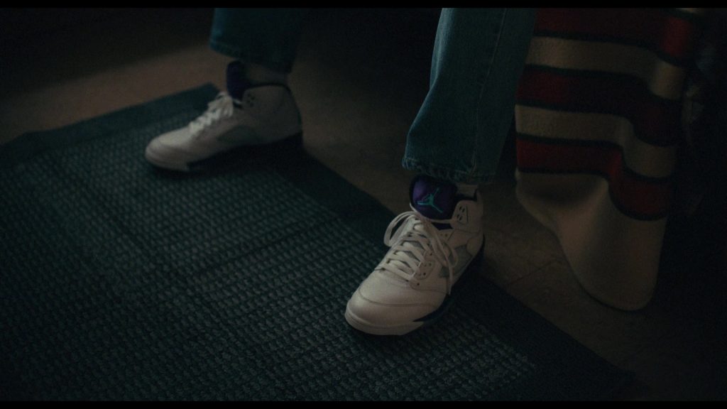 Nike Air Jordan 5 Retro OG “Grape” sneakers in white with purple and emerald green accents in Bad Thoughts S02E01 “Bad Impulses” (2026) (Image 1)
