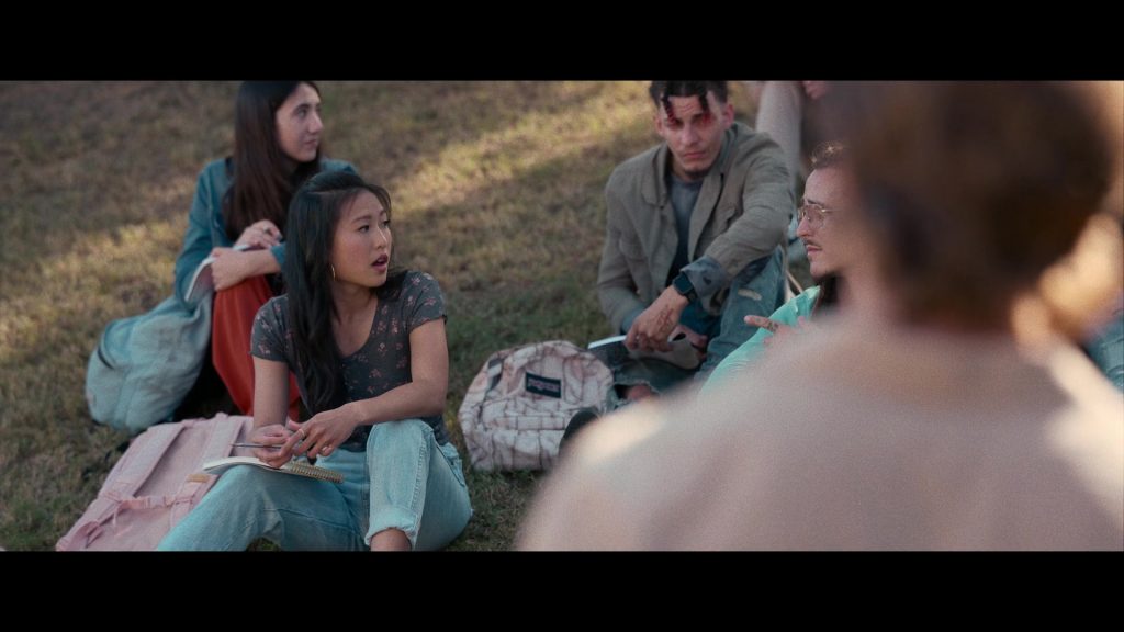 Nike Air Jordan Sneakers and JanSport Backpack in Hit Man (2023) (Image 1)