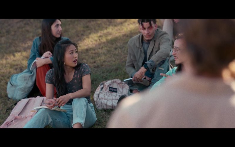 Nike Air Jordan Sneakers and JanSport Backpack in Hit Man (2023) (Image 1)