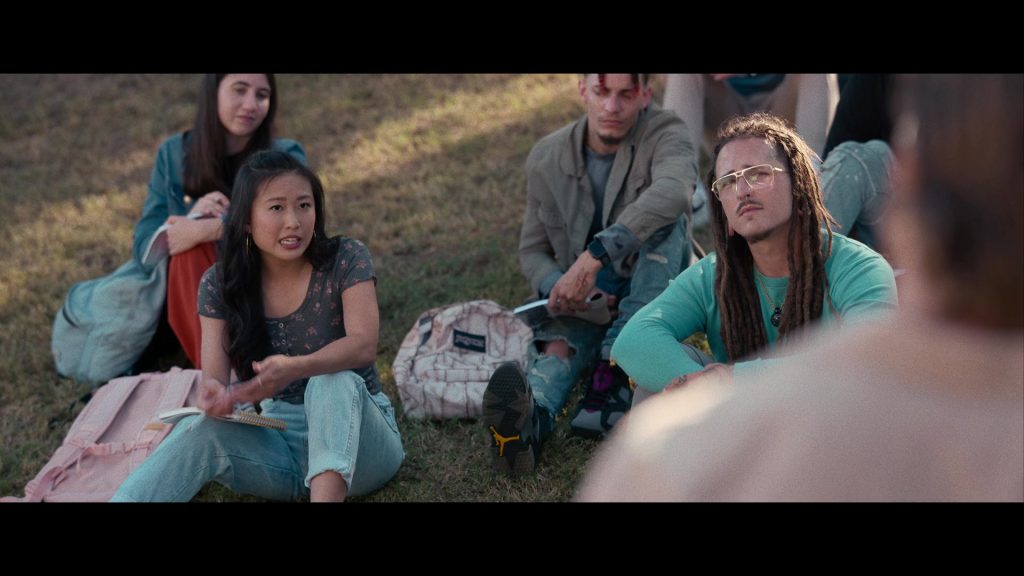 Nike Air Jordan Sneakers and JanSport Backpack in Hit Man (2023) (Image 10)