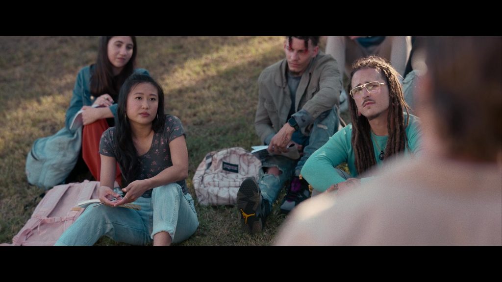Nike Air Jordan Sneakers and JanSport Backpack in Hit Man (2023) (Image 11)
