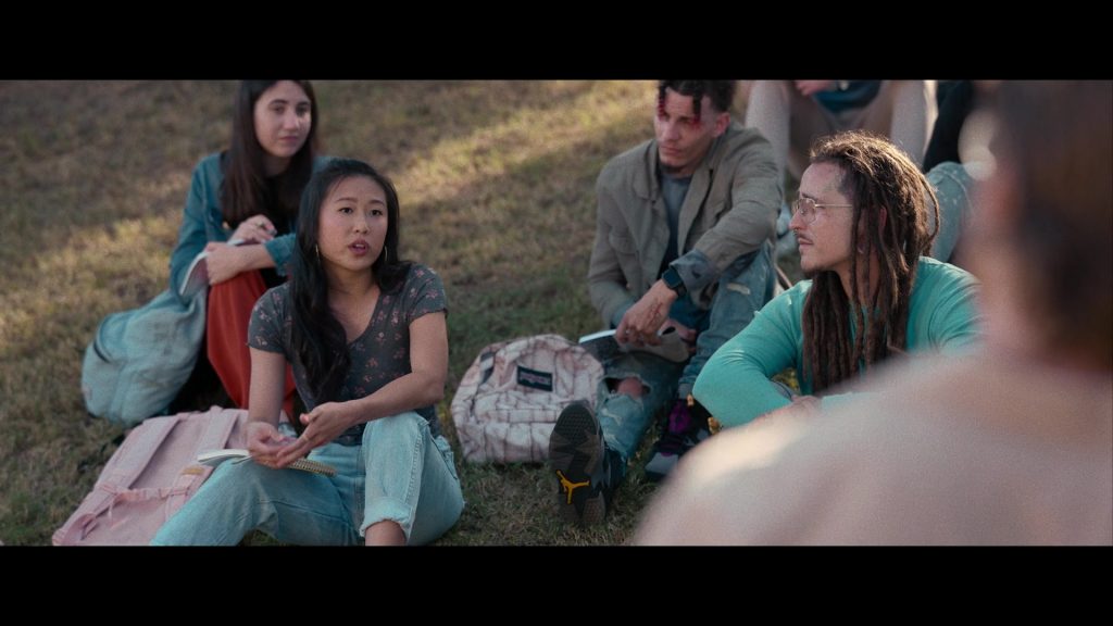 Nike Air Jordan Sneakers and JanSport Backpack in Hit Man (2023) (Image 13)