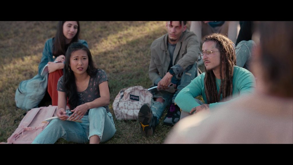 Nike Air Jordan Sneakers and JanSport Backpack in Hit Man (2023) (Image 14)